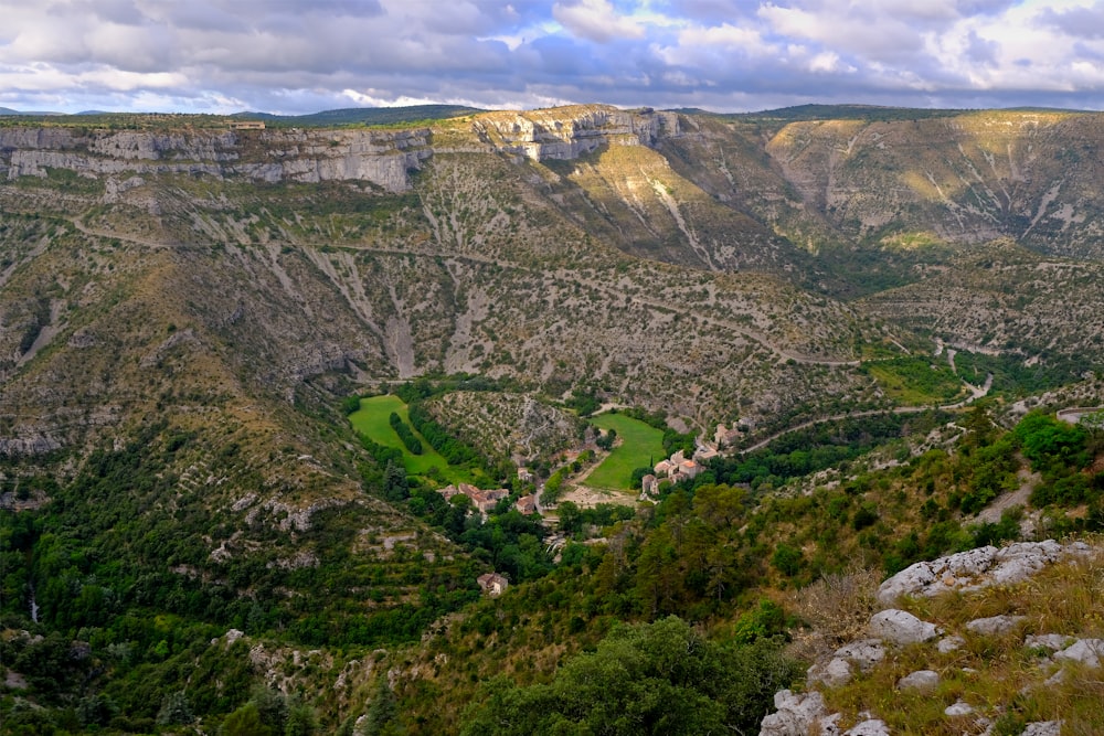 a scenic view of a valley and mountains