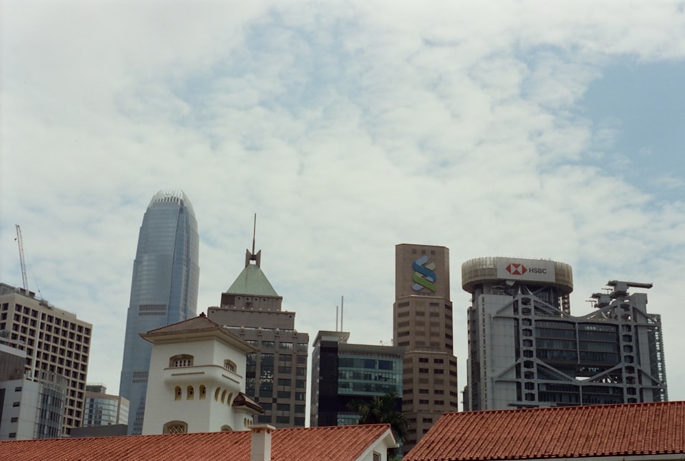 a city skyline with buildings and a clock tower
