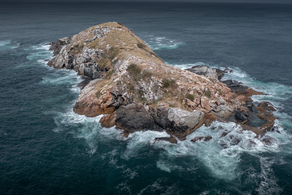 an aerial view of an island in the middle of the ocean