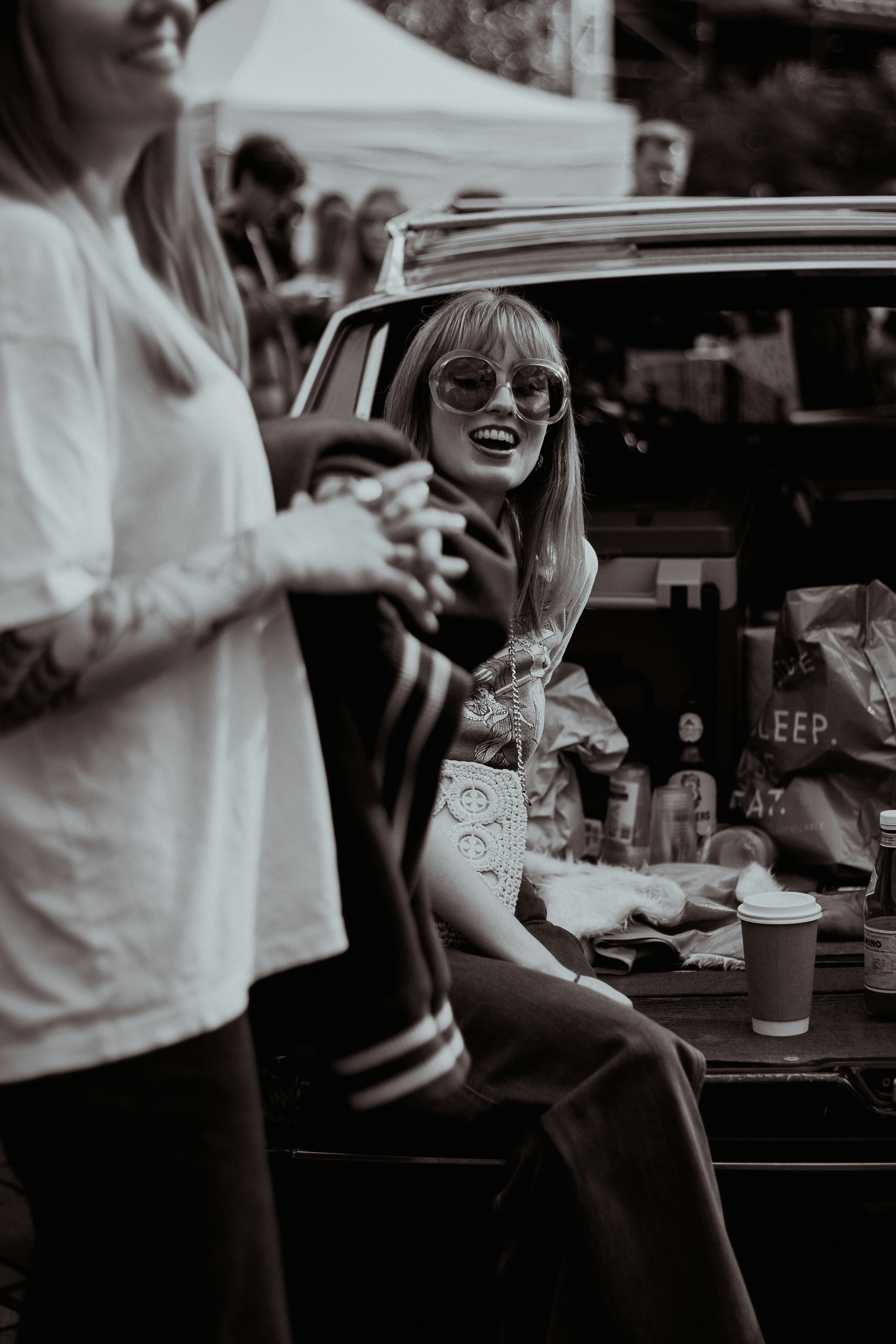 A fashion model wearing a modern blazer with bell-bottom jeans, illustrating a seamless blend of retro and contemporary styles.