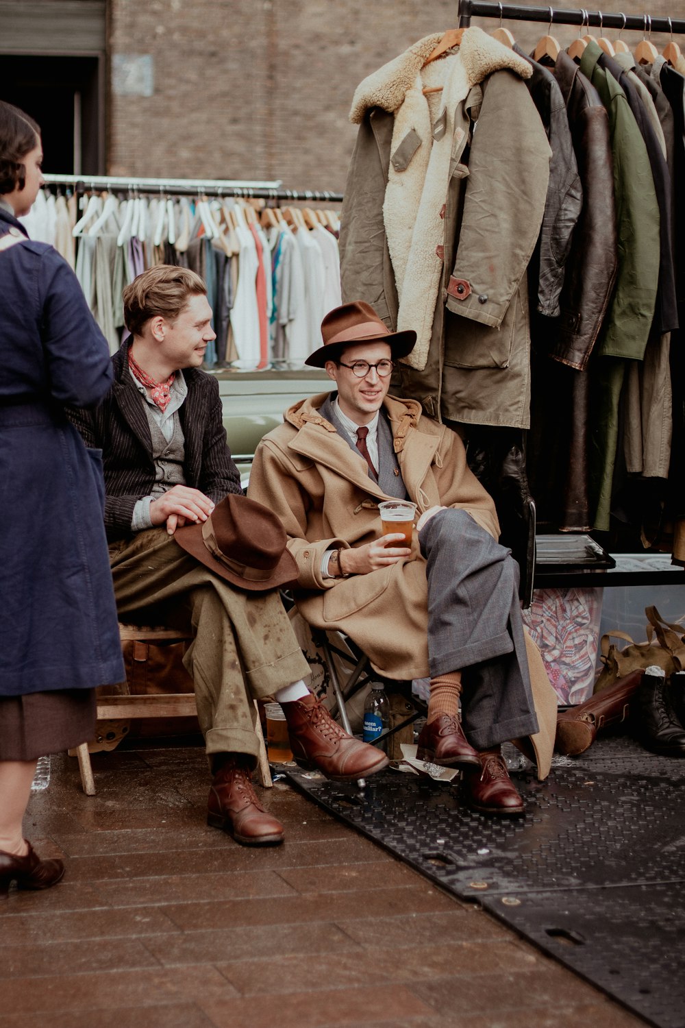 a man sitting in a chair next to a woman