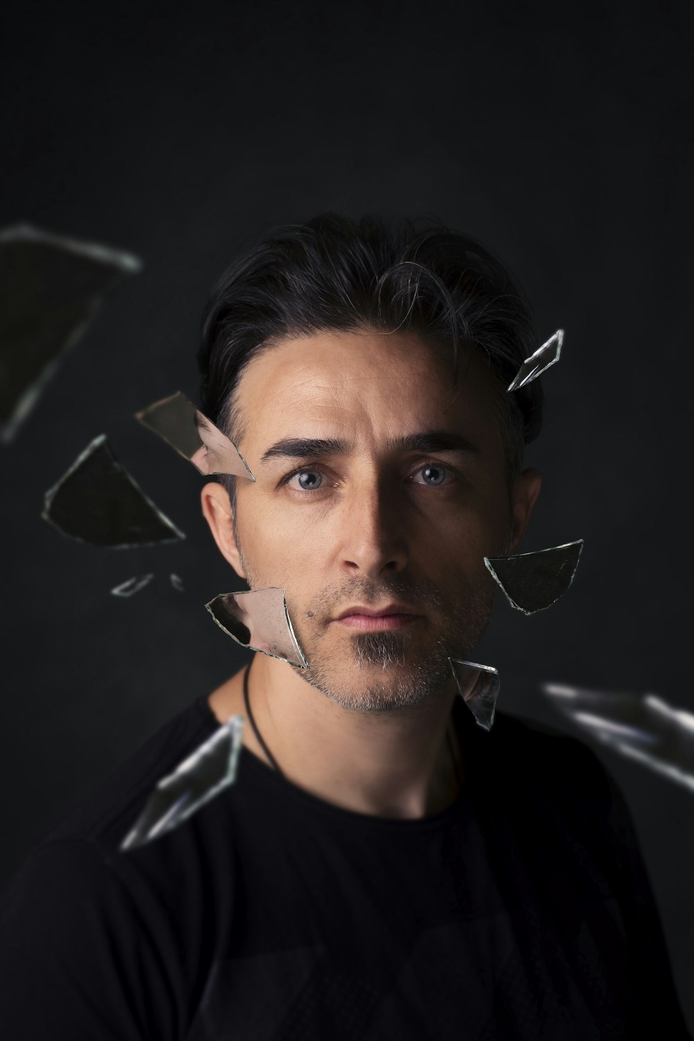 a man with broken glass on his face