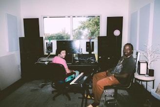 a man and a woman sitting in a room
