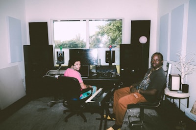 a man and a woman sitting in a room