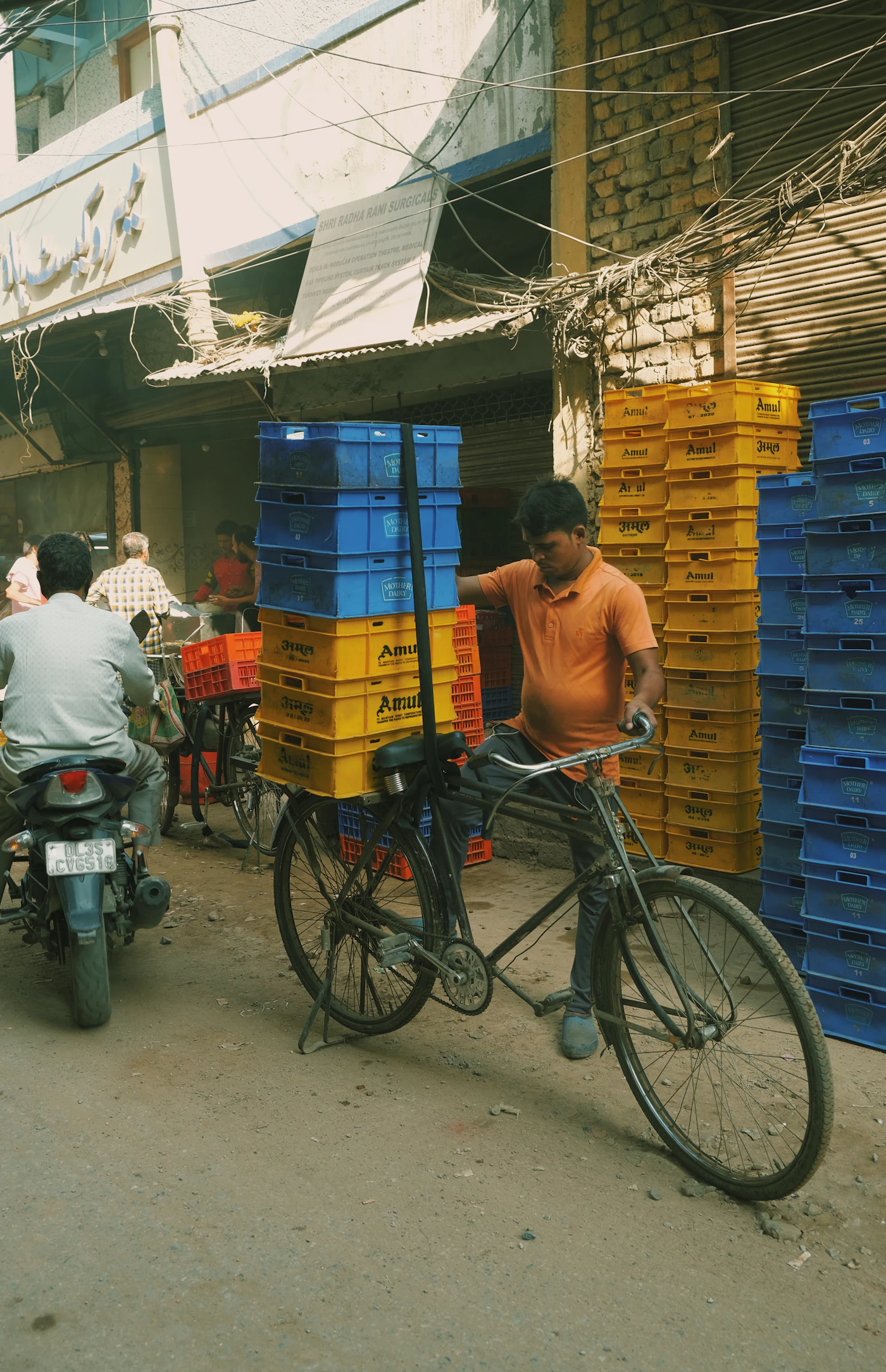 A delivery rider on a motorcycle on a city street