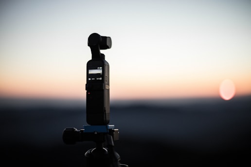 a cell phone sitting on top of a tripod