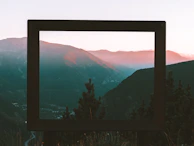 Ahmad Raza framing a serene mountain sunset with focused intensity.