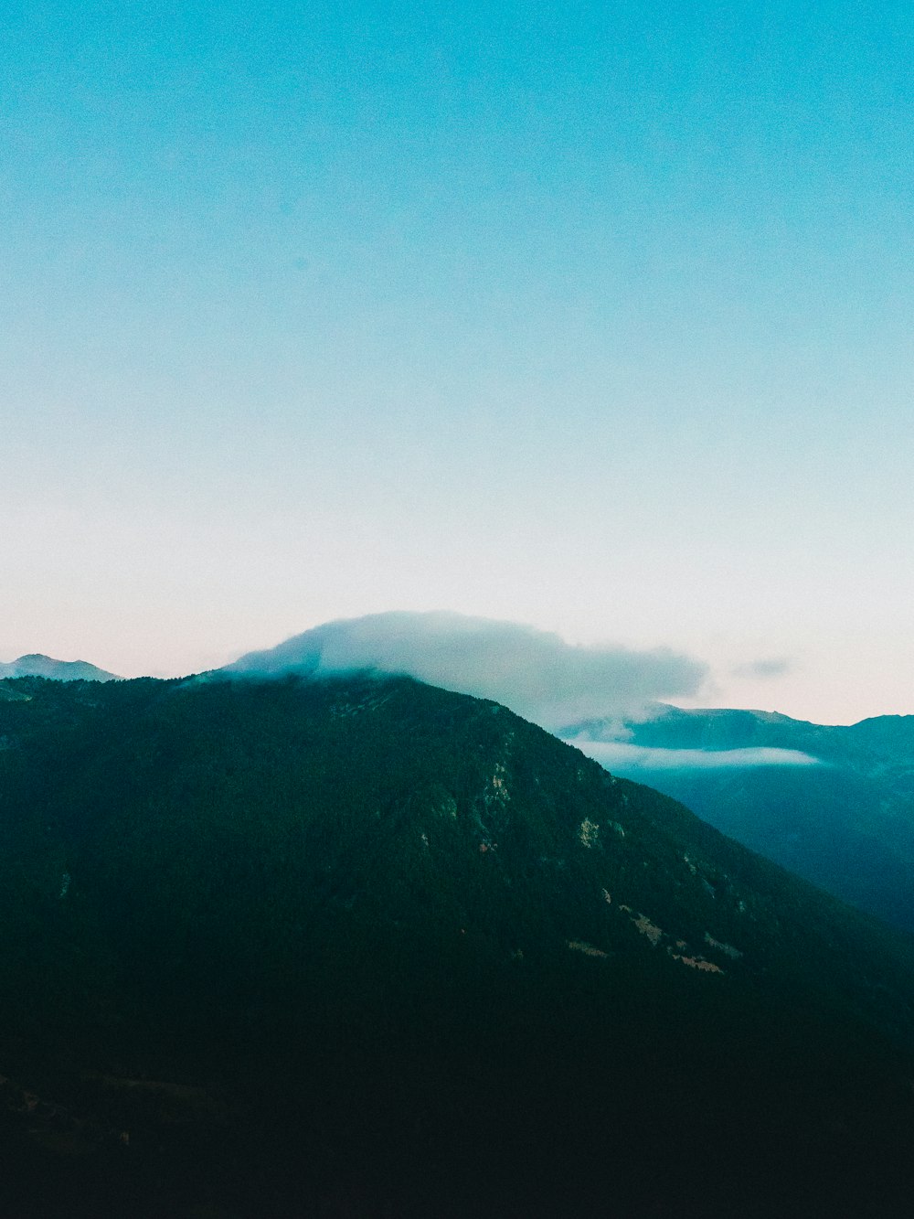 a view of the top of a mountain in the distance