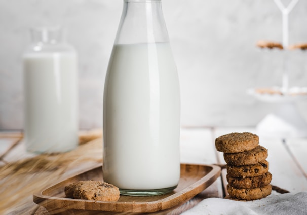 a bottle of milk and some cookies on a table