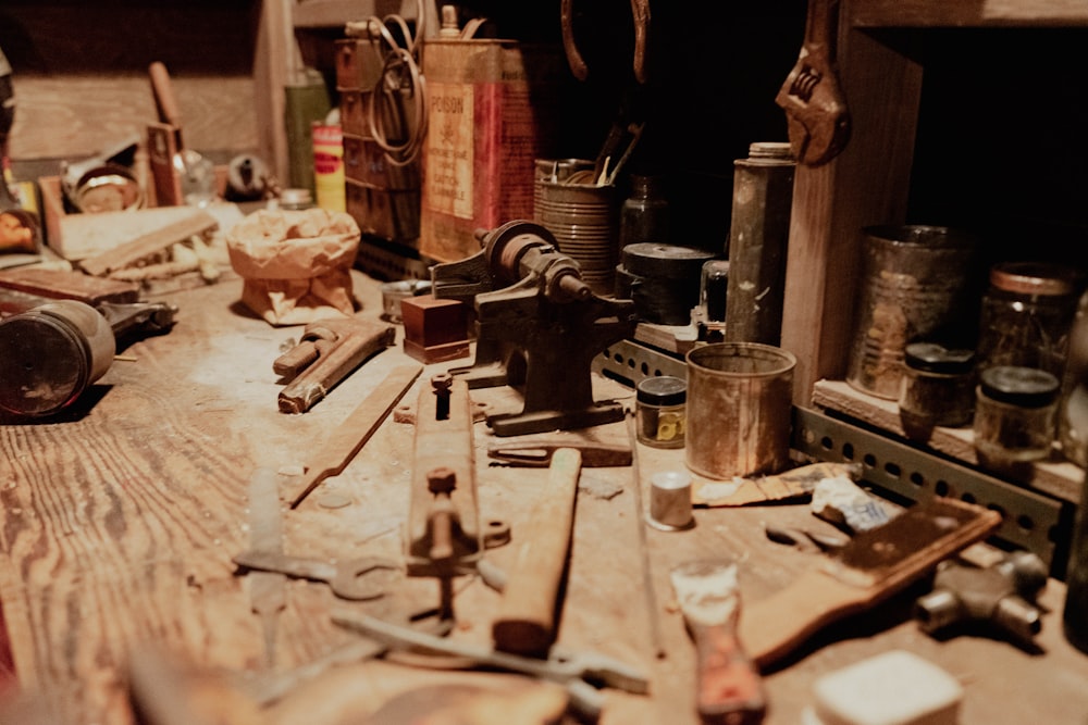 a wooden table topped with lots of tools