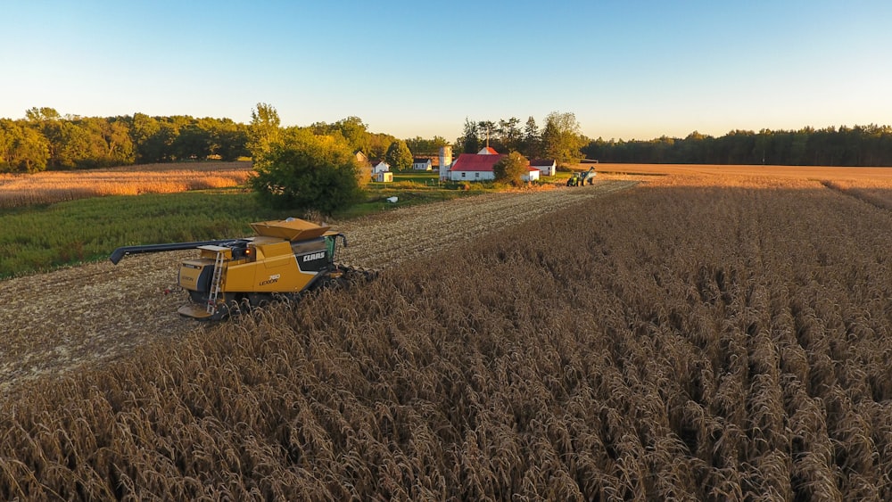 a combine is in the middle of a field