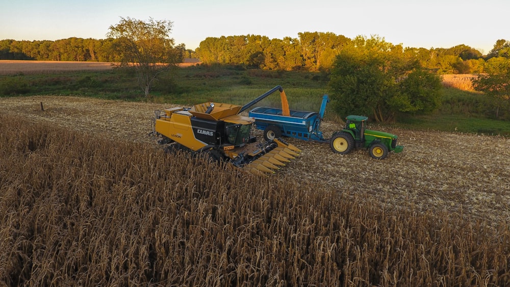 a tractor and a tractor trailer in a field