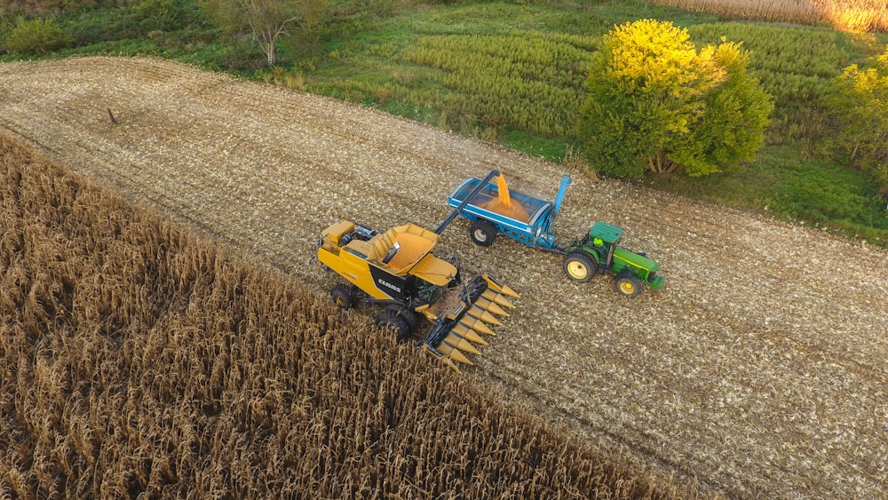 a couple of tractors that are in a field