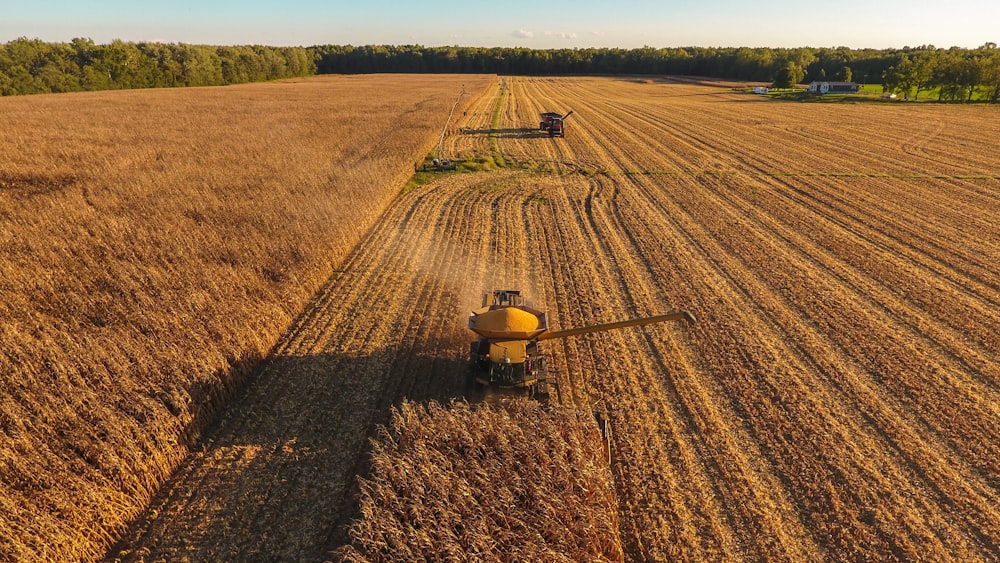 a tractor is driving through a large field