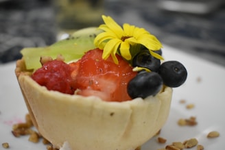 A colorful fruit tart with a golden crust and vibrant seasonal fruits.