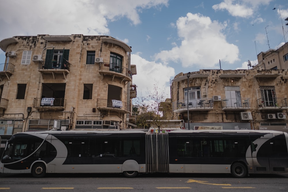 a couple of buses parked next to each other on a street