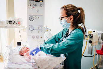 Healthcare workers providing newborn care in a rural clinic.