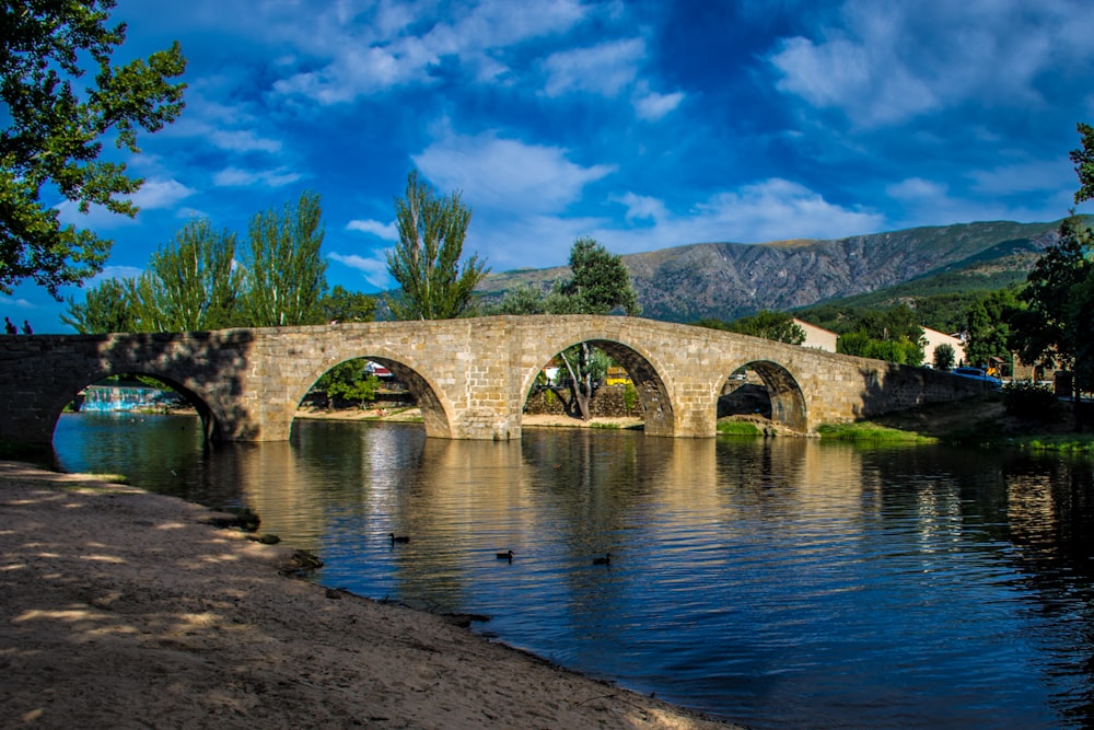 a stone bridge over a body of water