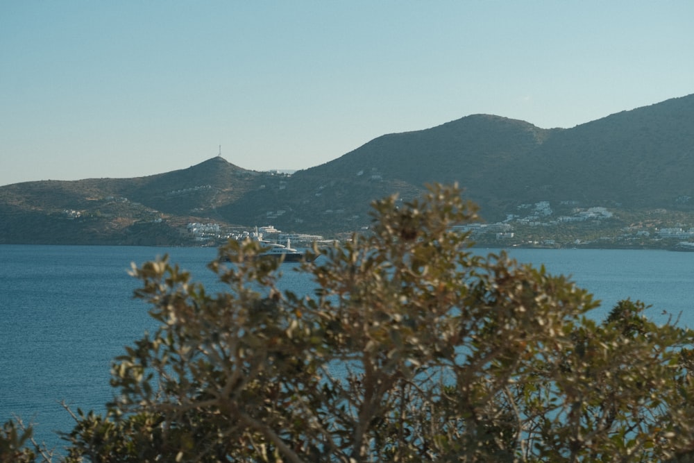 a view of a body of water with mountains in the background