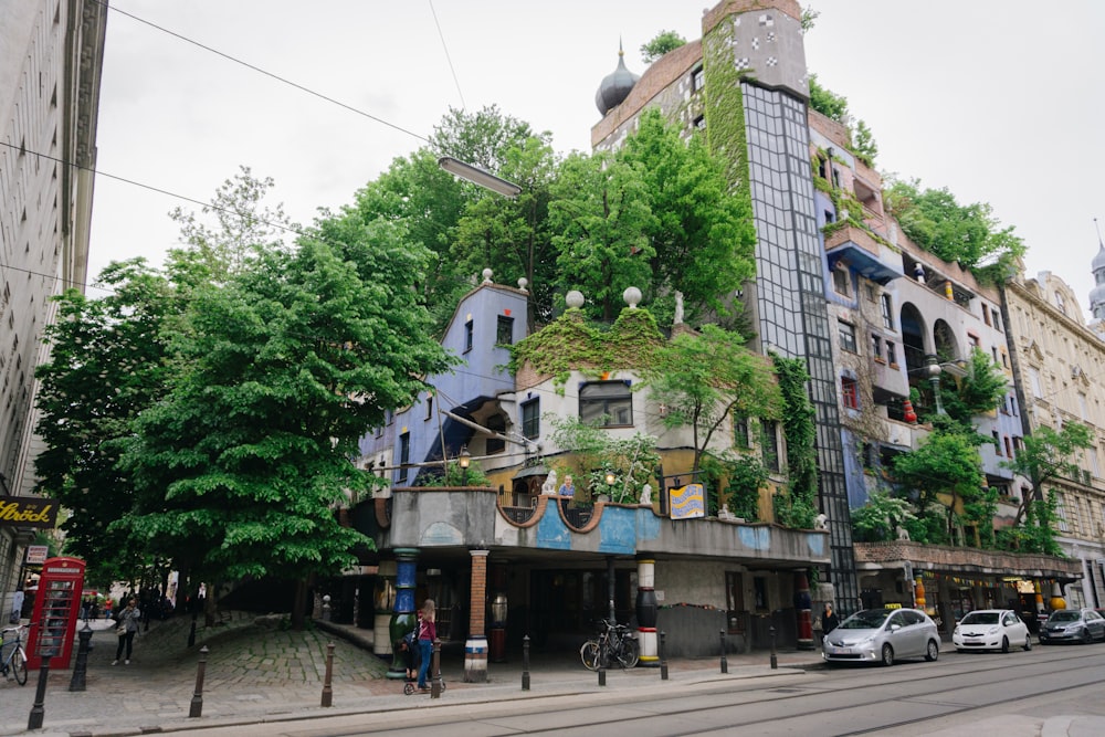 a very tall building with lots of plants growing on it