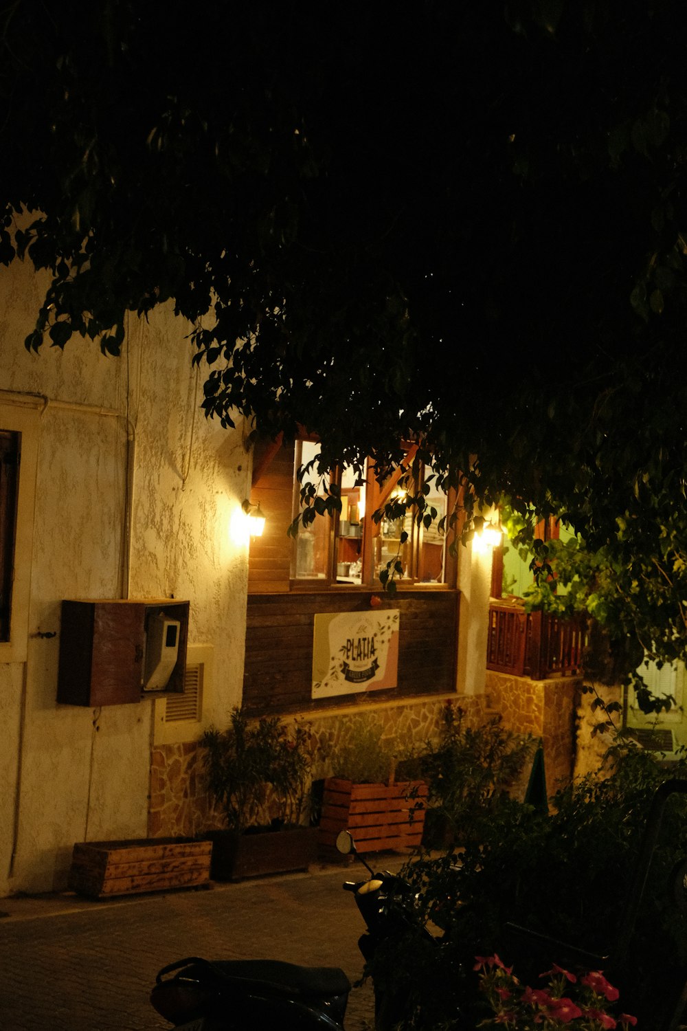 a motorcycle parked in front of a building at night