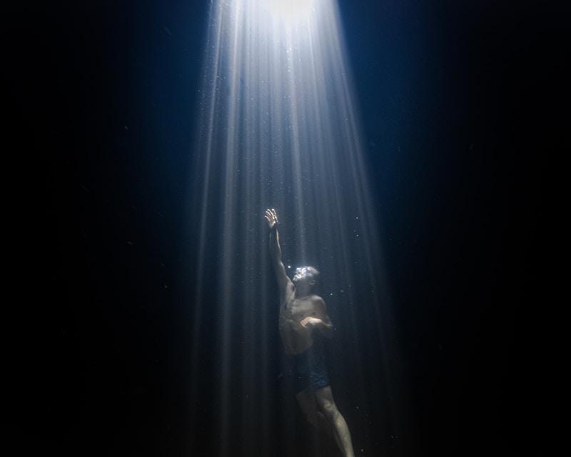 Ethereal light beams through water — evoking altered states of consciousness