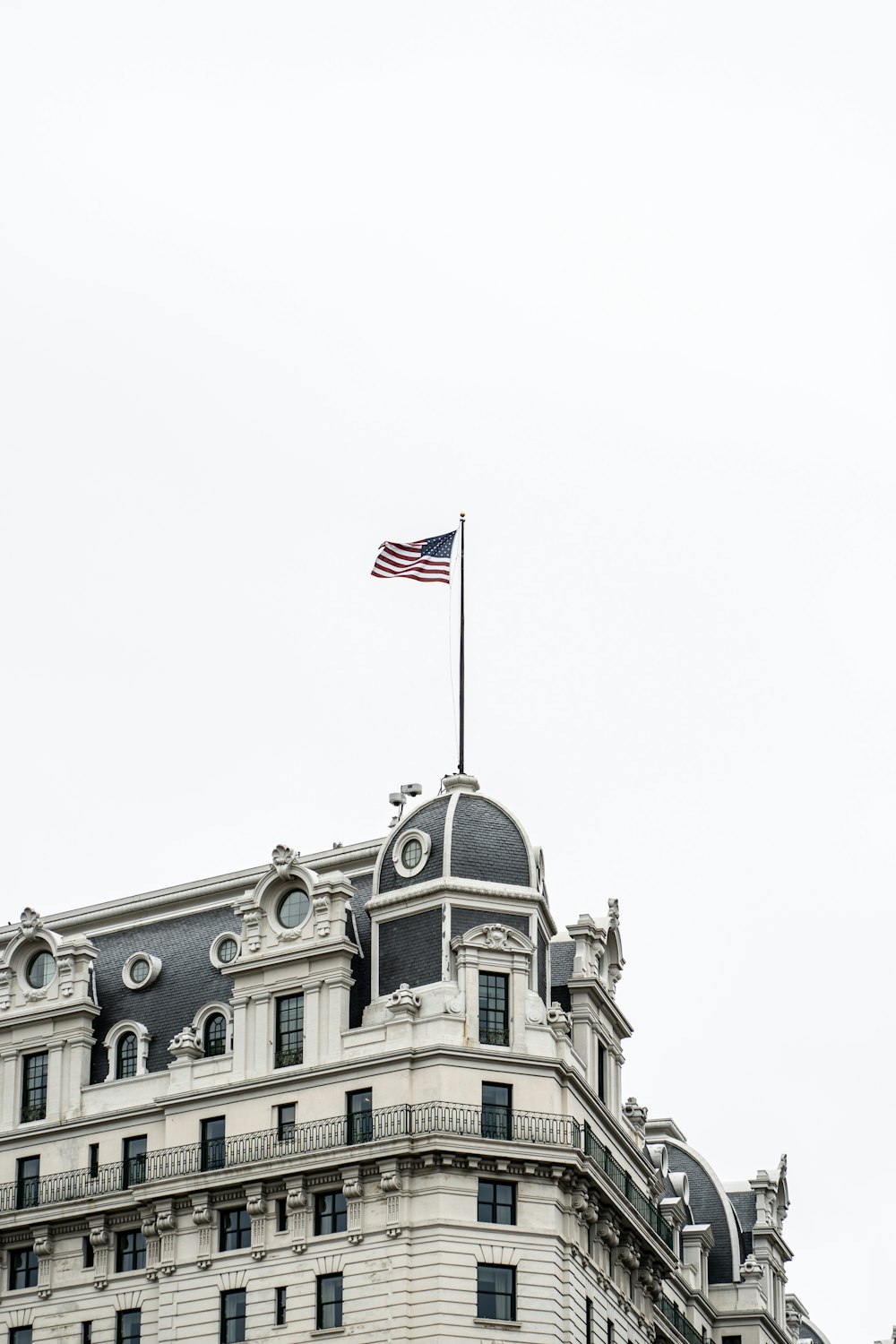 a large building with a flag on top of it