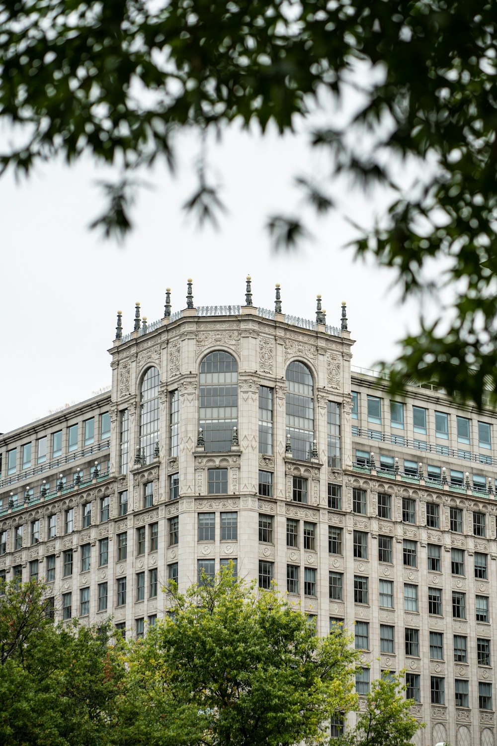 a tall building with a clock on the top of it