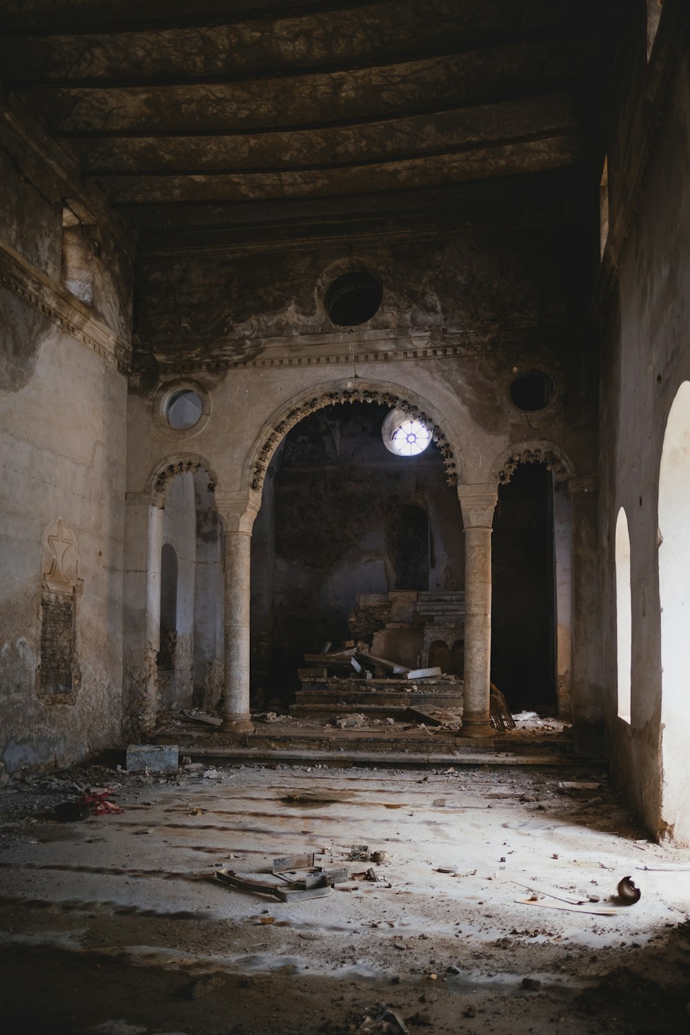 an old building with a lot of debris on the floor