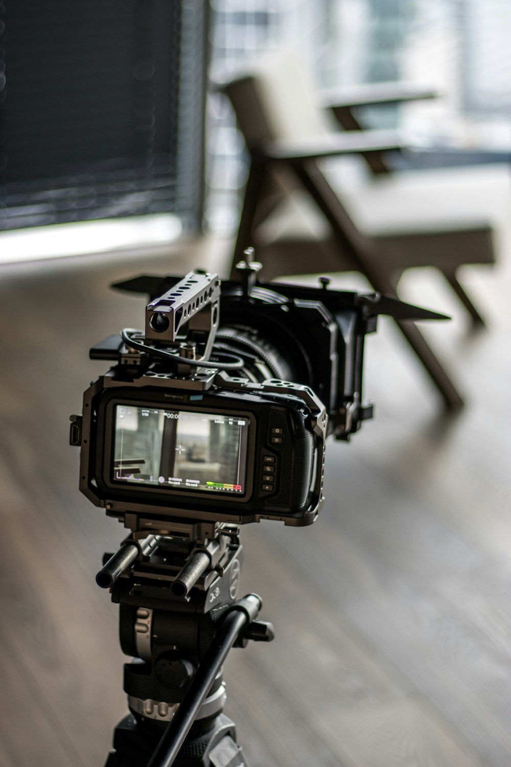 a video camera sitting on top of a tripod