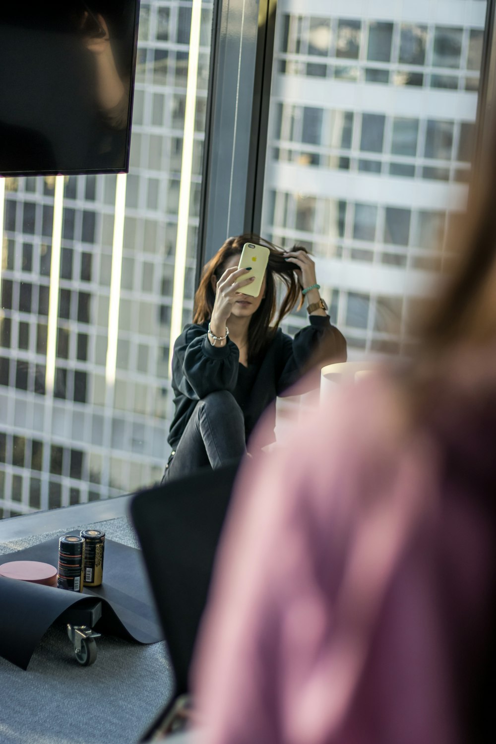 a woman taking a picture of herself in a mirror