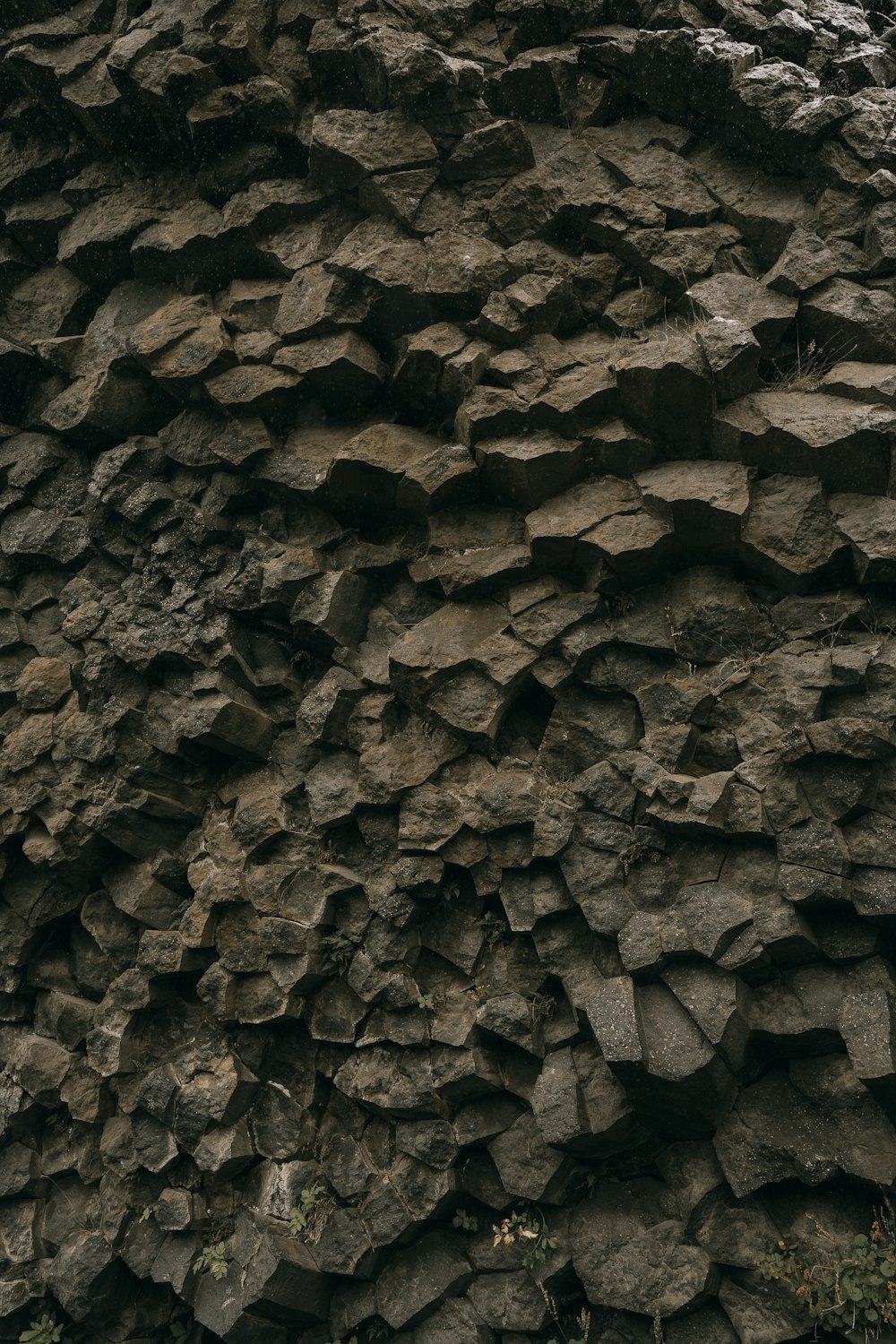 a black and white photo of a rock formation