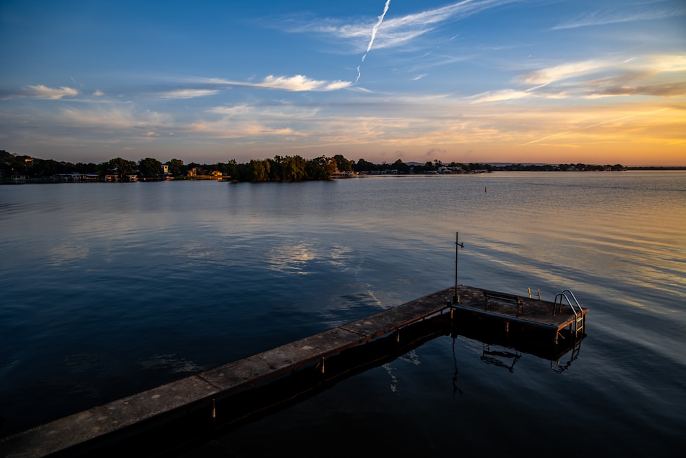 a boat sitting on top of a body of water