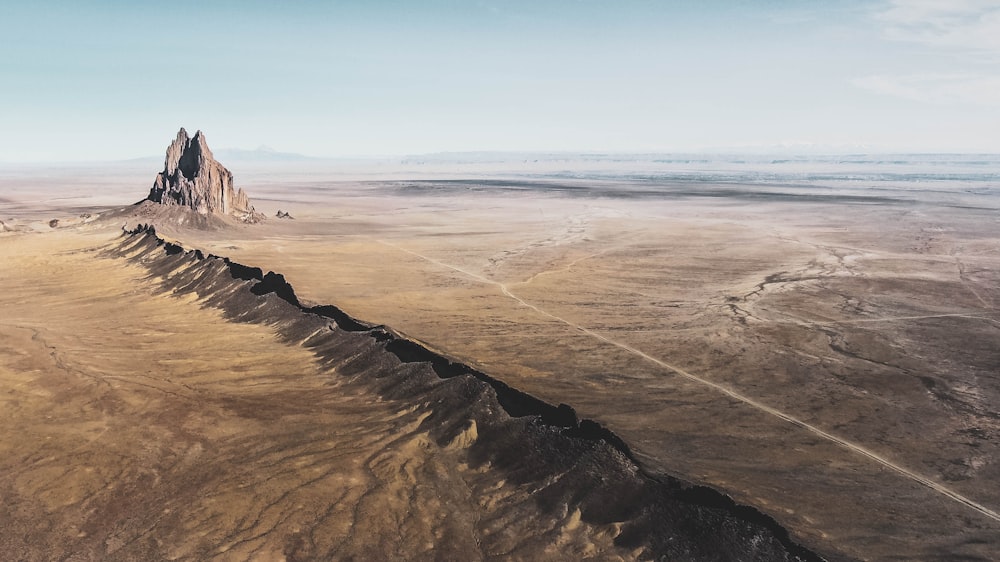 an aerial view of a mountain in the desert