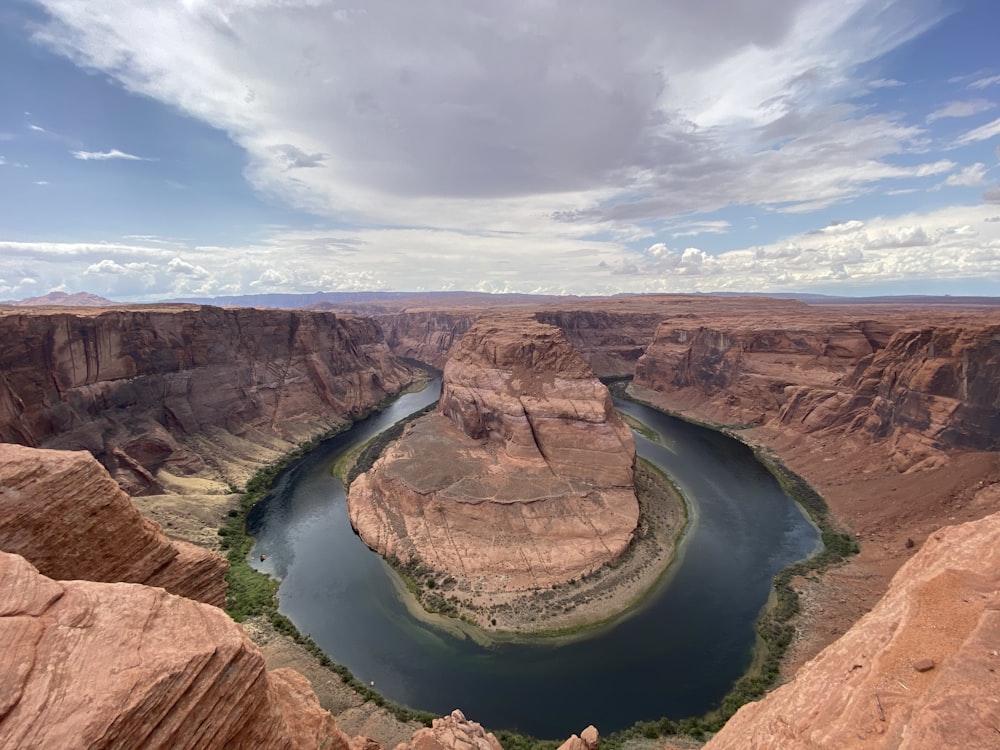 a river flowing through a canyon surrounded by mountains