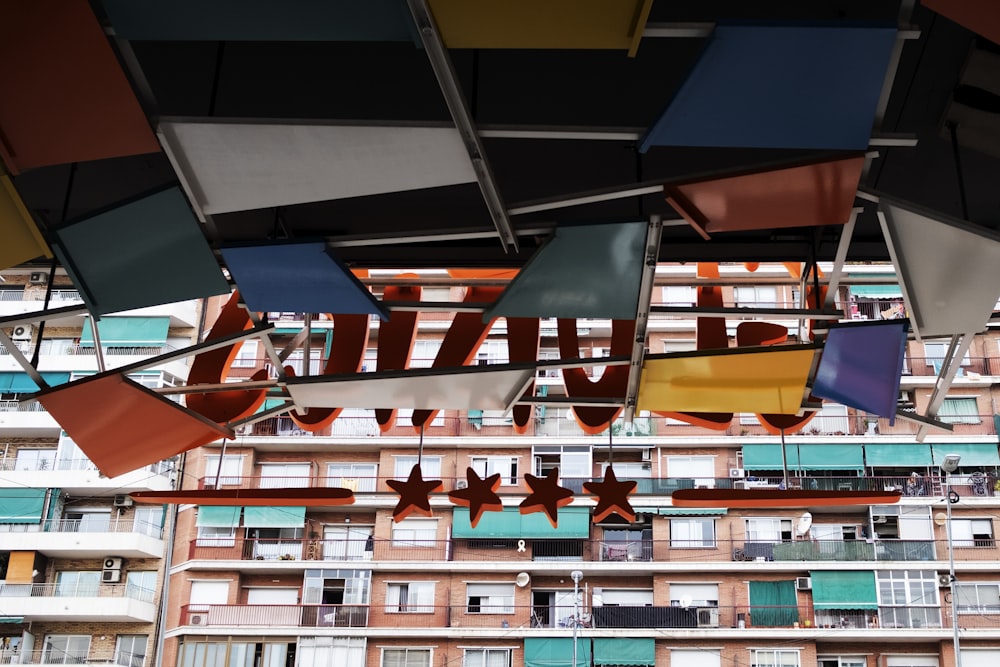 a group of stars hanging from the ceiling of a building