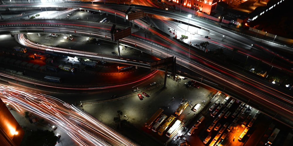 a city street filled with lots of traffic at night