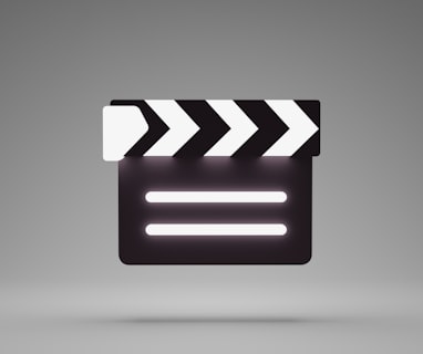 a black and white movie clapper on a gray background