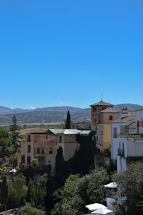A scenic view of a famous landmark surrounded by lush greenery and a clear blue sky.
