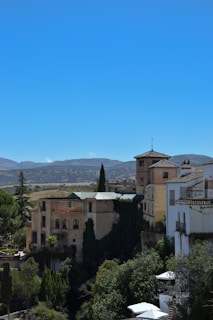 A serene image of a historical site surrounded by mountains.