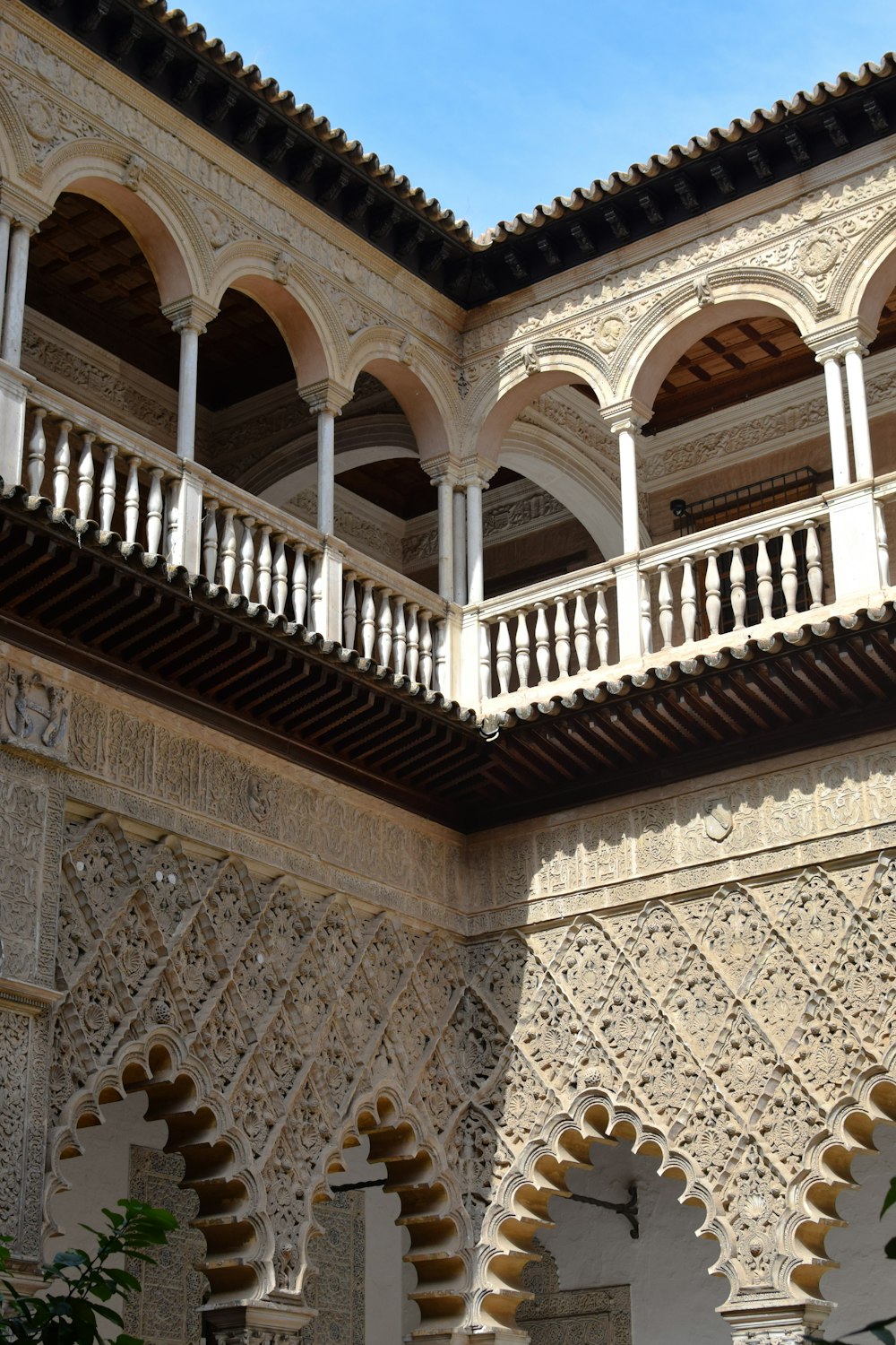 a building with arches and a clock on the wall