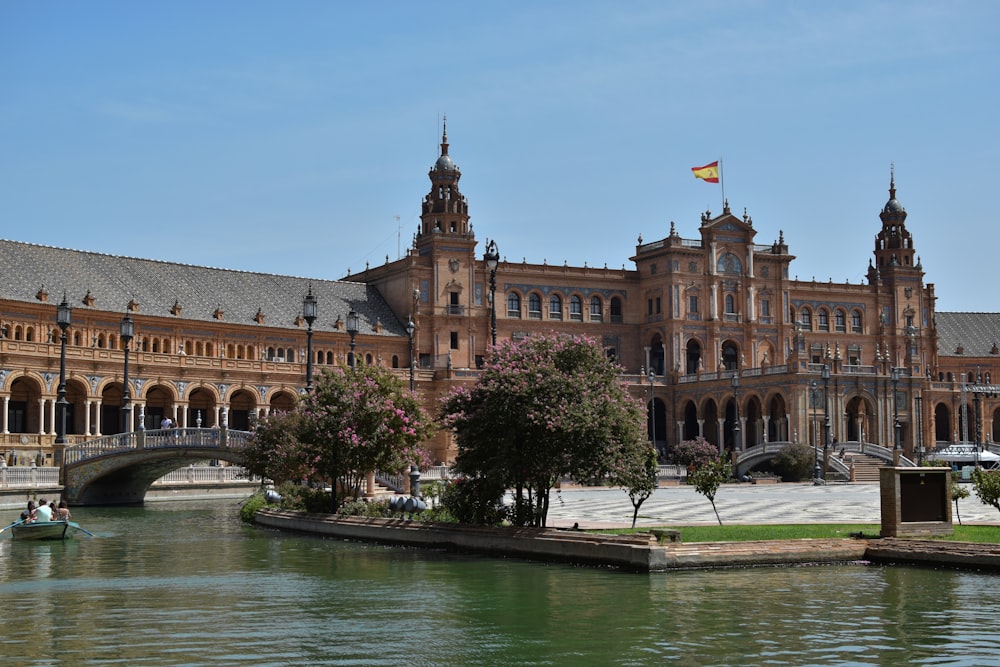 a large building sitting next to a body of water