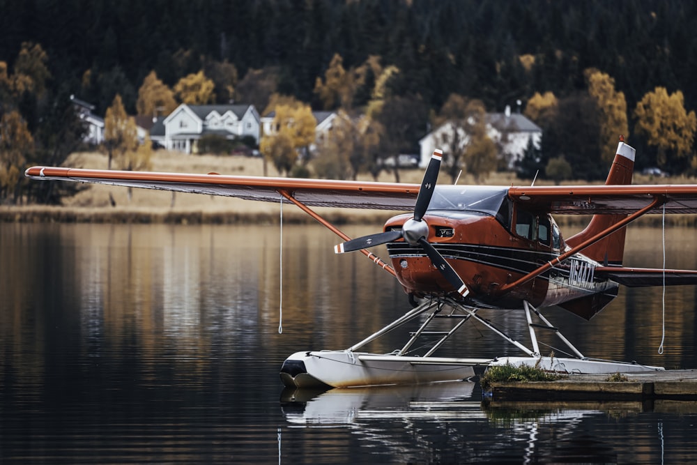 a small plane sitting on top of a body of water