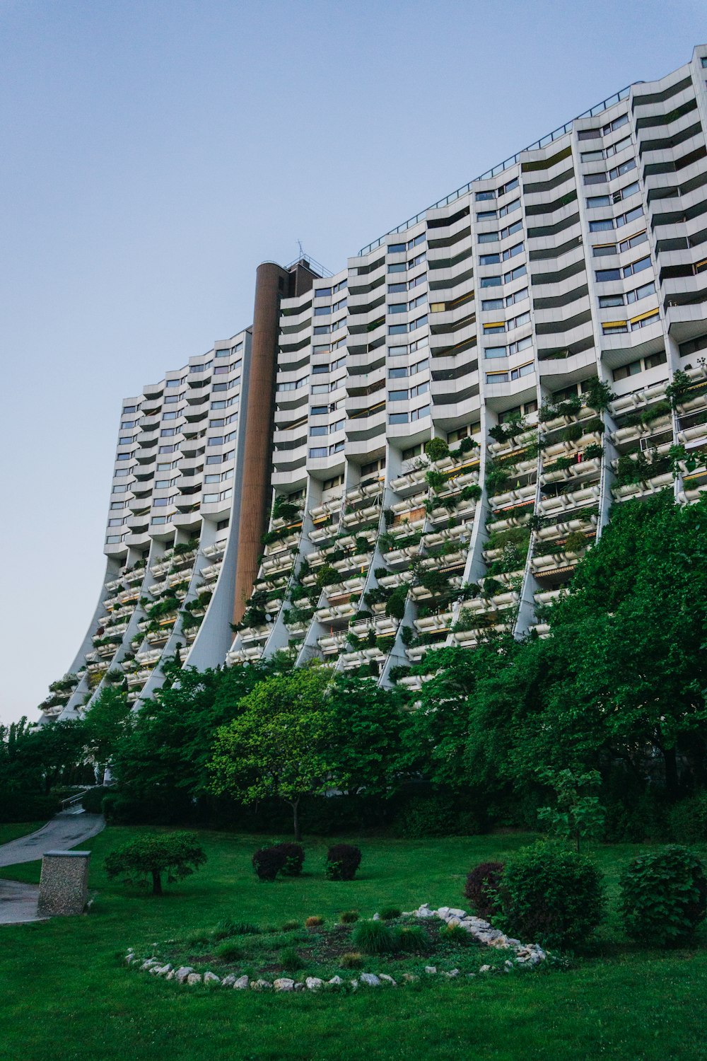 a very tall building with many balconies on it