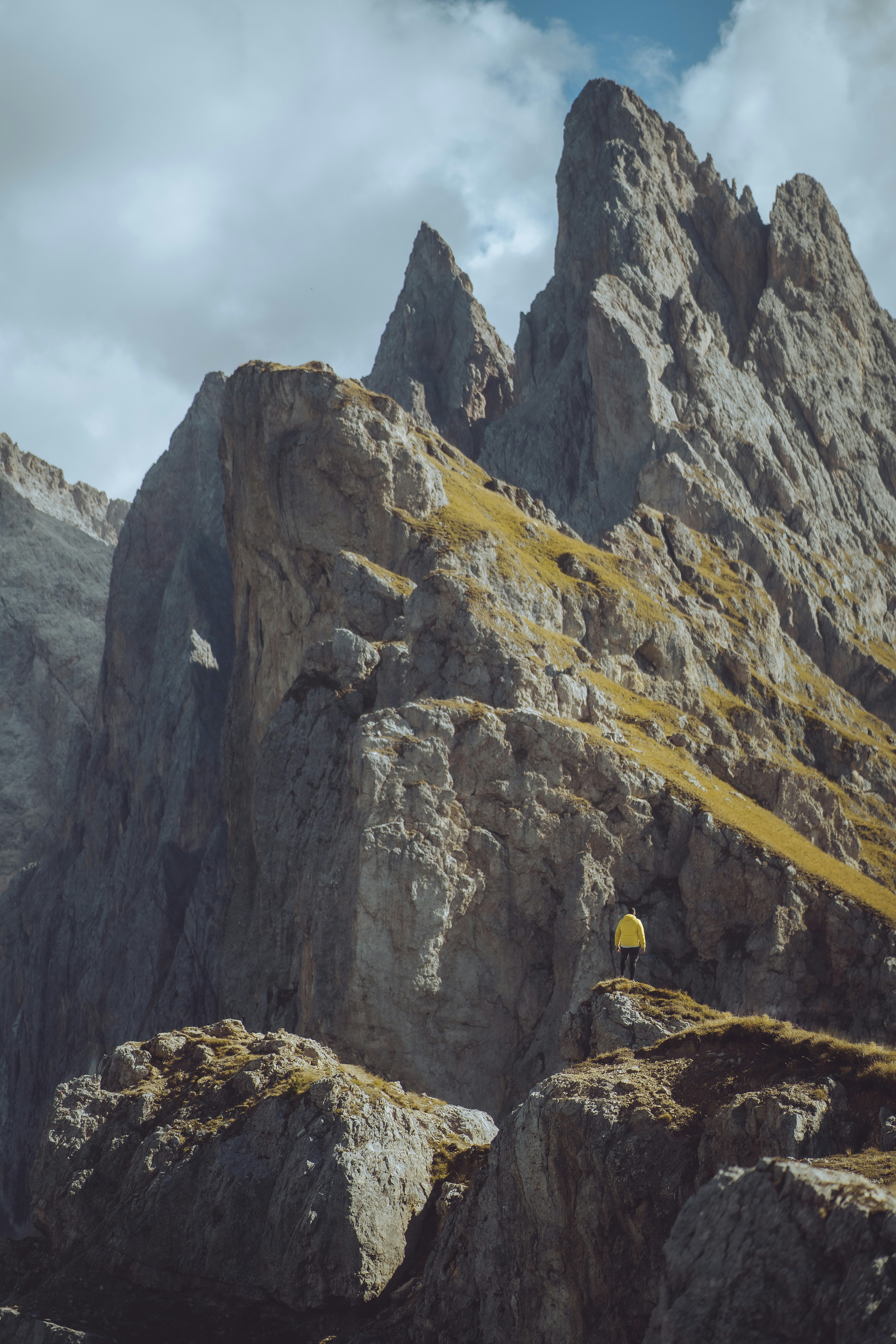 a person standing on top of a rocky mountain