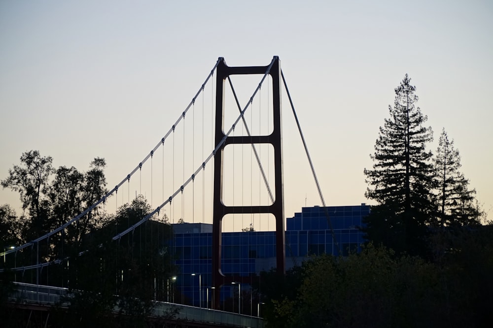 a bridge with a building in the background