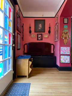 A cozy corner featuring colorful wall art and decor.