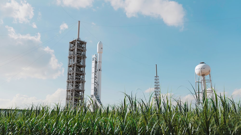 a tall tower with a rocket on top of it