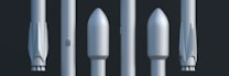 A lineup of five rocket components is displayed vertically against a dark background. Each component shows different stages or sections of a rocket, including what appear to be nose cones and booster stages. The components have a sleek, metallic surface with minimalistic detailing.
