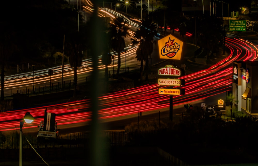 a long exposure photo of a fast food restaurant at night